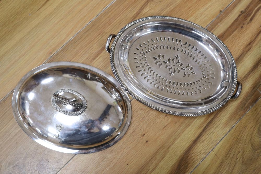 A large oval plated galleried tray and a collection of plated items,